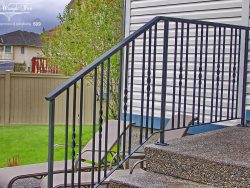 ribbon-twists-in-basic-wrought-iron-railing calgary