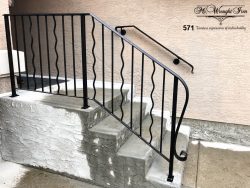 wavy-spindle-railing-and-extended-termination calgary